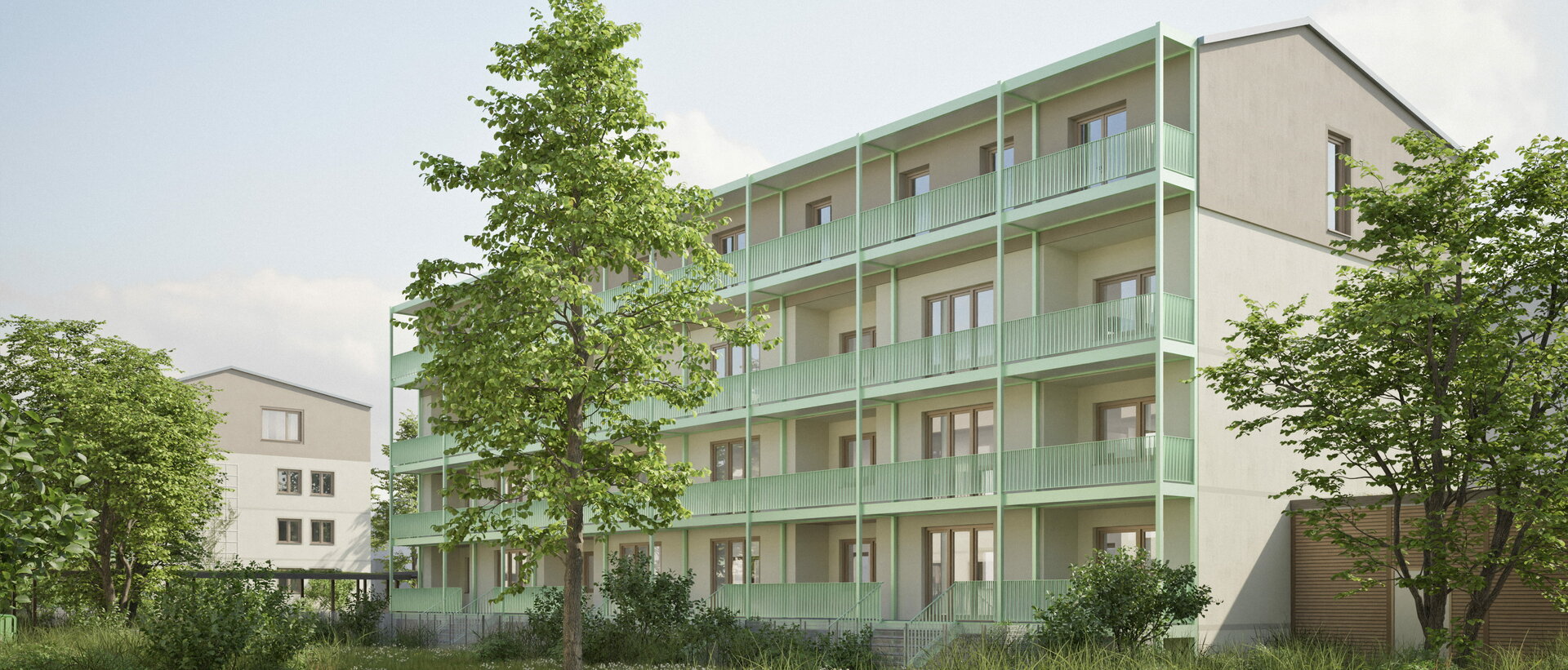 Nach energetischer Sanierung: Mehrstöckiges Wohngebäude mit Balkonen und umliegendem Grün in einer Wohnanlage in Hannover.