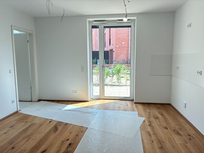 Wohnzimmer mit offener Küche